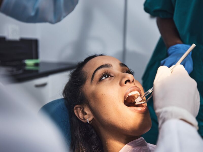 Making gentle work of dental work. Shot of a young woman having dental work done on her teeth